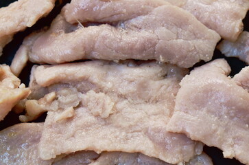 close up of boiled soft pork slice arranging on plate