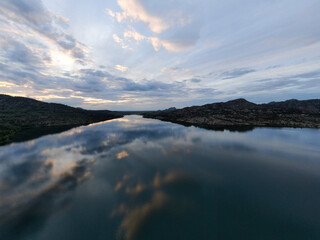 Fototapeta na wymiar Lake in the mountains in the evening