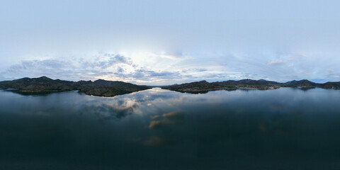 Panorama of the lake in the mountains in the evening