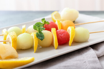 Fresh fruits on skewers, closeup