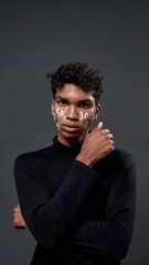 Boy with advertising lettering on his face