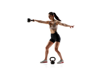 Fototapeta na wymiar Balance. Caucasian professional female athlete training isolated on white studio background. Muscular, sportive woman. Concept of action, motion, youth, healthy lifestyle. Copyspace for ad.