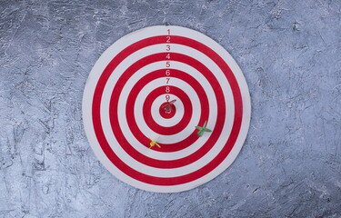 Business and success concept. Hitting in the target. Dartboard and arrow.