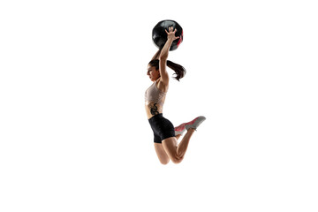 In air. Caucasian professional female athlete training isolated on white studio background. Muscular, sportive woman. Concept of action, motion, youth, healthy lifestyle. Copyspace for ad.