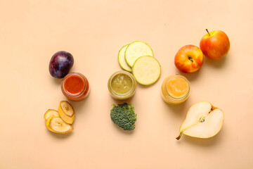 Jars with different baby food and ingredients on color background