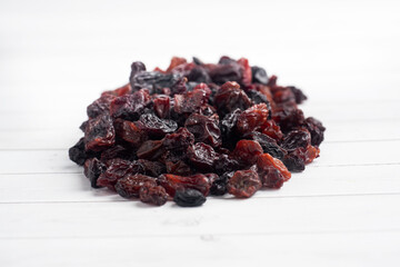 A handful of delicious dried raisins from dark grapes.
