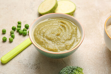 Composition with healthy baby food and ingredients on light background, closeup
