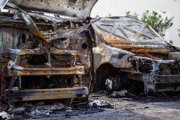 Fototapeta na wymiar Remains of a car and van destroyed by fire accident