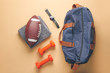 Composition with bag and sports equipment on color background