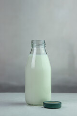 Milk in a glass bottle. Isolated milk on the table. Milk product.