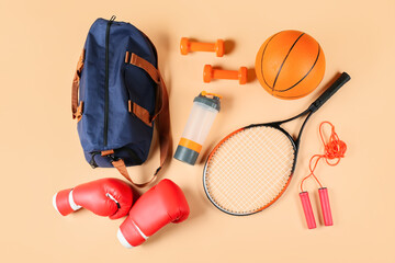 Composition with bag and sports equipment on color background