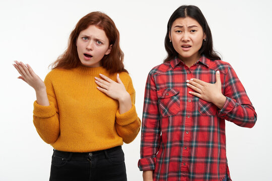 People And Lifestyle Concept. Displeased Friends Pointing On Themselves, Unhappy Asking. Wearing Yellow Sweater And Checkered Shirt. Watching At The Camera, Isolated Over White Background