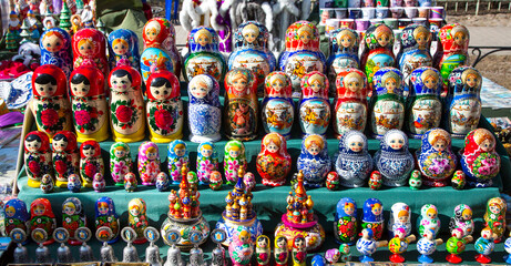 Fototapeta premium Traditional souvenirs from Russia - colorful nesting dolls, also known as matryoshka, stacking dolls or Russian dolls