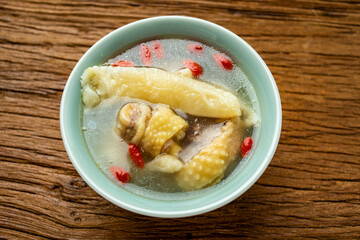 A bowl of stewed chicken soup with wolfberry flower maw