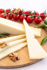 Close-up old cheddar on wooden background. Local name eski kaşar peynir