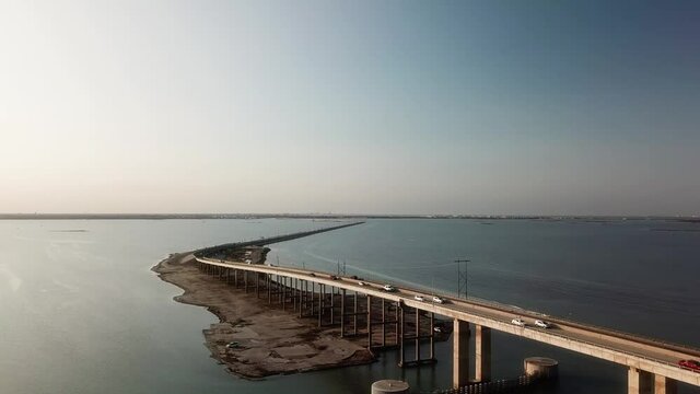 Aerial drone view of the JFK Memorial Causeway bridge and Laguna Madre between North Padre Island and Corpus Christi Texas on a sunny, late afternoon