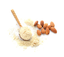 Spoon with almond flour and nuts on white background