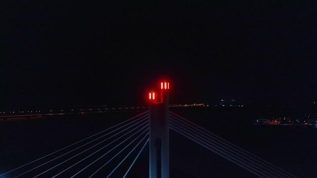 Aerial view of the light on the Jatkankynttila bridge,  evening, in Rovaniemi, Finland - tracking, drone shot