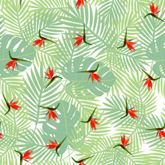 Tropical seamless pattern of flowers bird of Paradise (strelitzia) on the background of palm leaves. Exotic illustration of jungle plants.