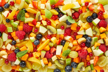 Fototapeta na wymiar Background of assorted fruits and berries