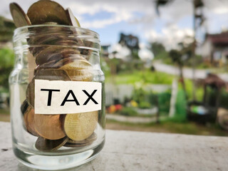 Obraz premium Tax-filling concept - Tax word on white surface background. Stock photo.