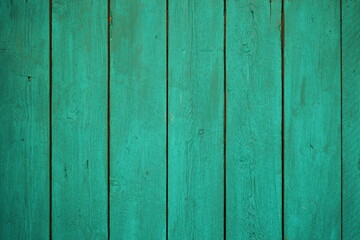 Wood texture with natural patterns. Wooden background painted with green paint. 
