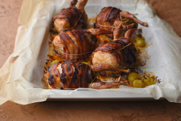 Baked quail with bacon and grapes