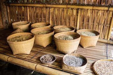 organic bags of a mature toasted a raw coffee beans put on a shelves at a warehouse