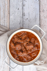Viennese beef goulash on the wooden table