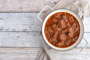 Viennese beef goulash on the wooden table