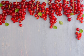 Red currant grapes on wooden background