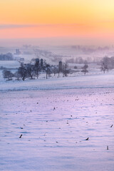 Naklejka premium Sunrise over fields