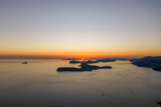 Aerial drone shot of sunset over Adriatic sea vie from Babin Kuk hill in Dubrovnik Croatia summer