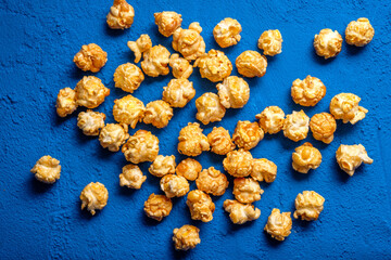 Popcorn on a blue background. View from above