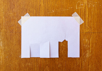 Tear off paper on wood wall. Mock up template. Street paper ad or announcement with tear-off...