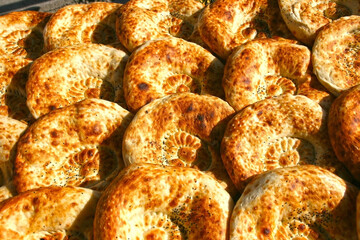 Traditional bread in Central Asia. Tandoor flatbread. Bread cakes. Traditional Uzbek the pellets.