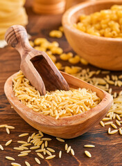 Ptititm or israeli couscous - kind of small pasta, traditional for israelian cuisine on an old...