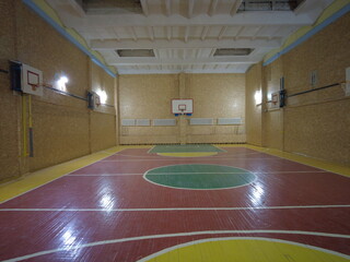 Fototapeta na wymiar basketball court. hoop and basketball backboard. basketball court. hoop and basketball backboard. a school or university gym with a basketball hoop.