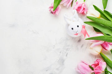 Easter table setting with floral decor and plate with easter gingerbread on white table. Elegance dinner. Mock up. Top view.