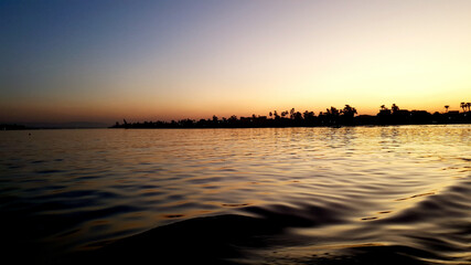 Fototapeta na wymiar Nil Flußfahrt im Sonnenuntergang Nile with Sunset