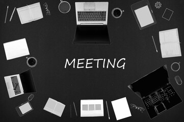 Meeting concept. Top layout of drawings of laptops, notepads, coffee, different business stuff on black background.