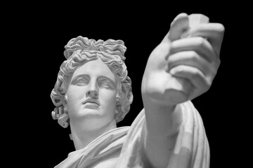 God Apollo bust sculpture. Ancient Greek god of Sun and Poetry Plaster copy of a marble statue isolated on black - obrazy, fototapety, plakaty