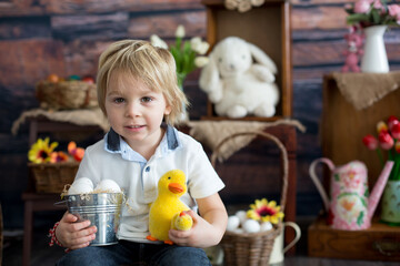 Cute toddler blond child, boy with easter decoration