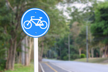 Bike path traffic sign blur background.