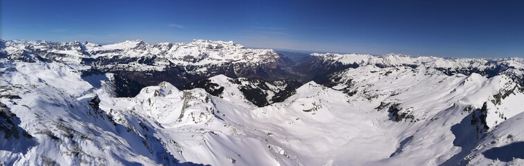 large winter panorama landscape picture from the chaerpf in the glarus mountains. Skimo, ski mountaineering. Sunny Day