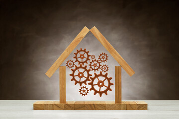 Metallic gears into iconic house on background