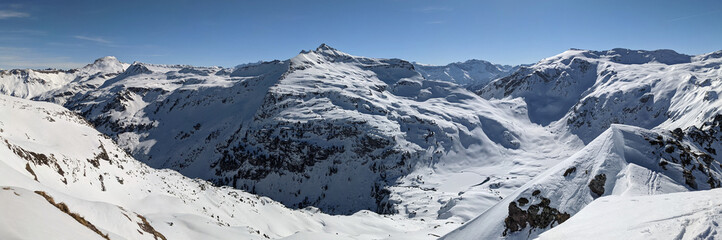 Fototapeta na wymiar Beautiful ski tour in the Glarus region with a breathtaking view of the snow-covered mountains. Skimo, mountaineering