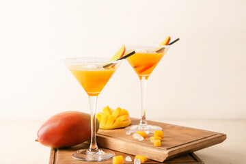 Glasses of mango margarita on table