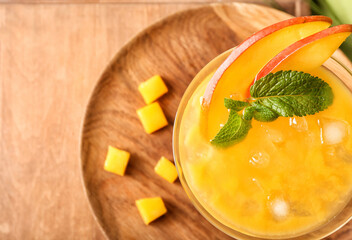 Glass of margarita with mango, closeup