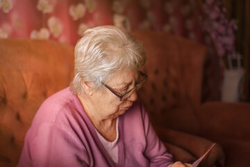 Grandma is having fun. Grandma is playing. Grandma is sad.